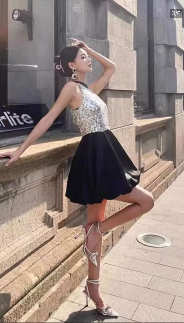 31. Elegant Silver Top with Black Skirt